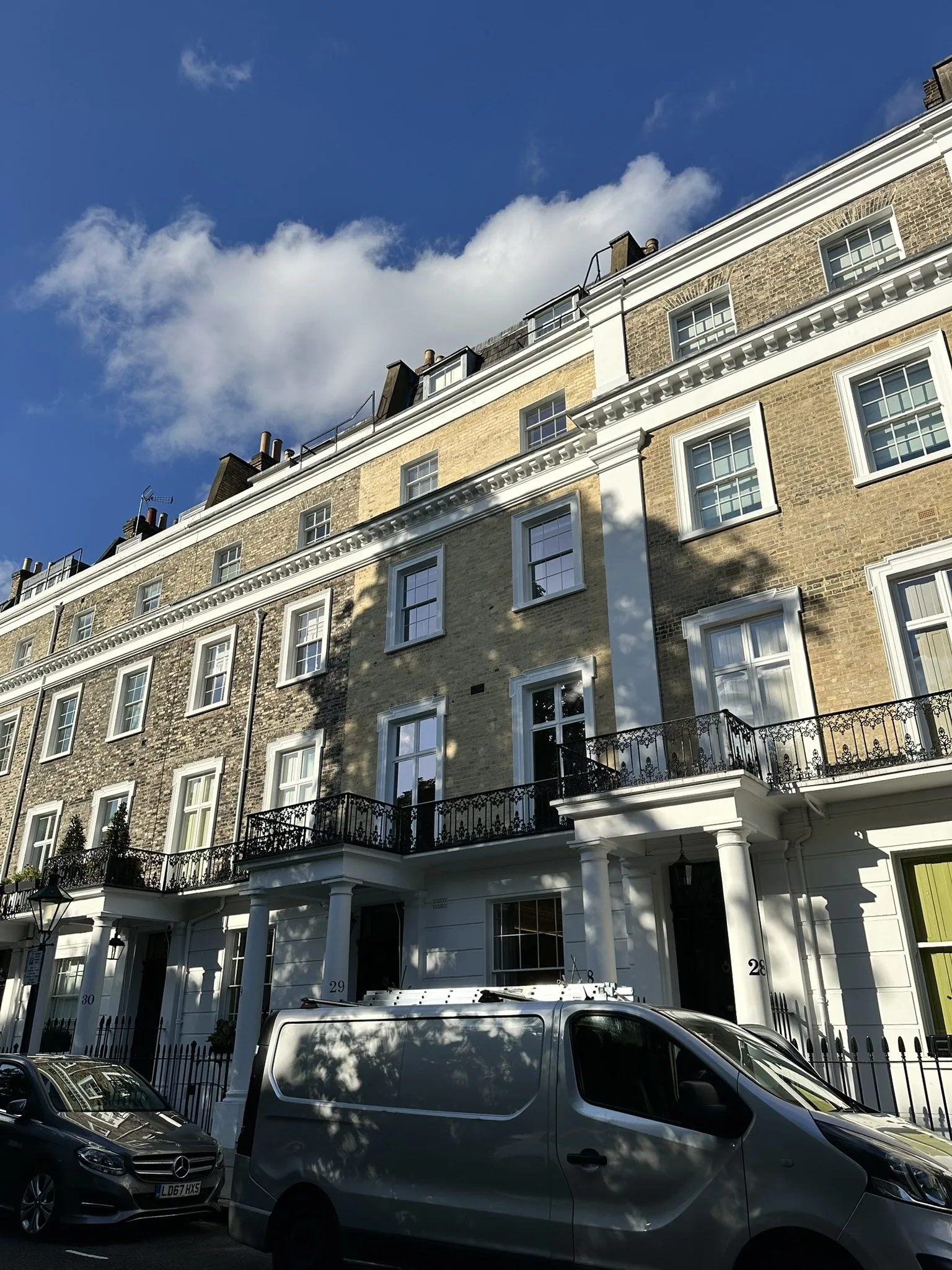 London townhouse facade with restored brickwork and traditional detailing