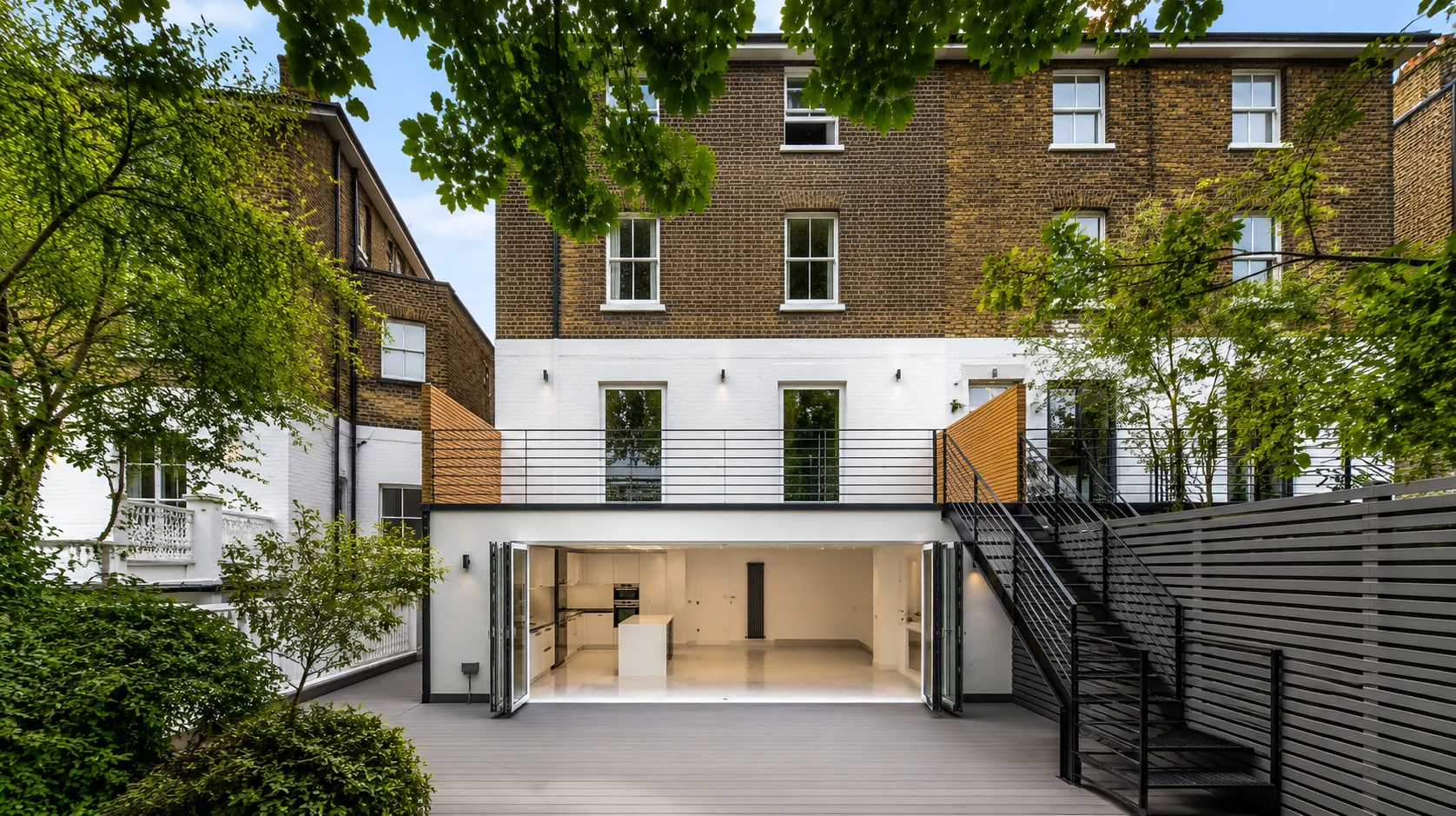 Landscaped rear elevation with a full-width glazed extension