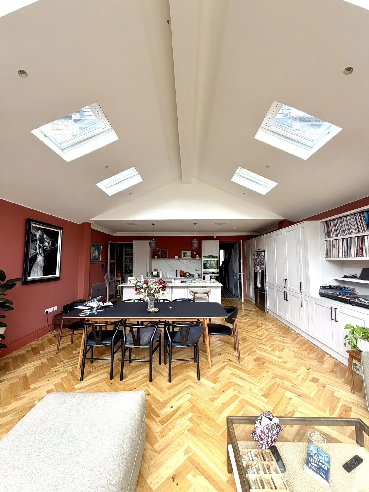 Open-plan kitchen and dining space under rooflights